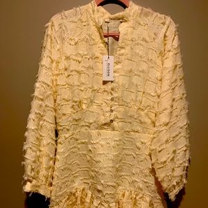 Boutique rich cream colored -tattered dress with capri shell buttons